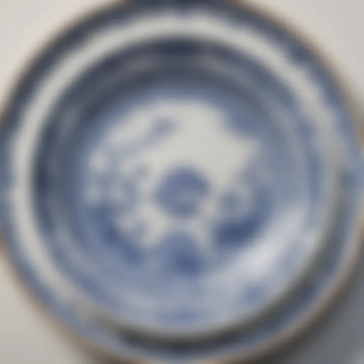 A vintage china plate with a classic blue and white pattern