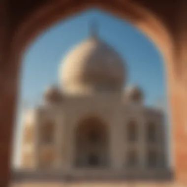 The intricate architectural details of the Taj Mahal against a clear blue sky