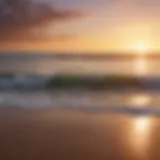 Serene beach with soft waves and a vibrant sunset