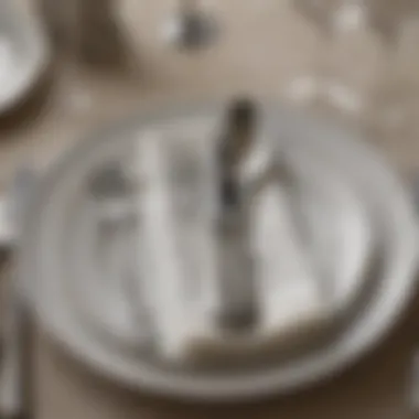 Close-up of place settings showcasing intricate silverware and napkin folds