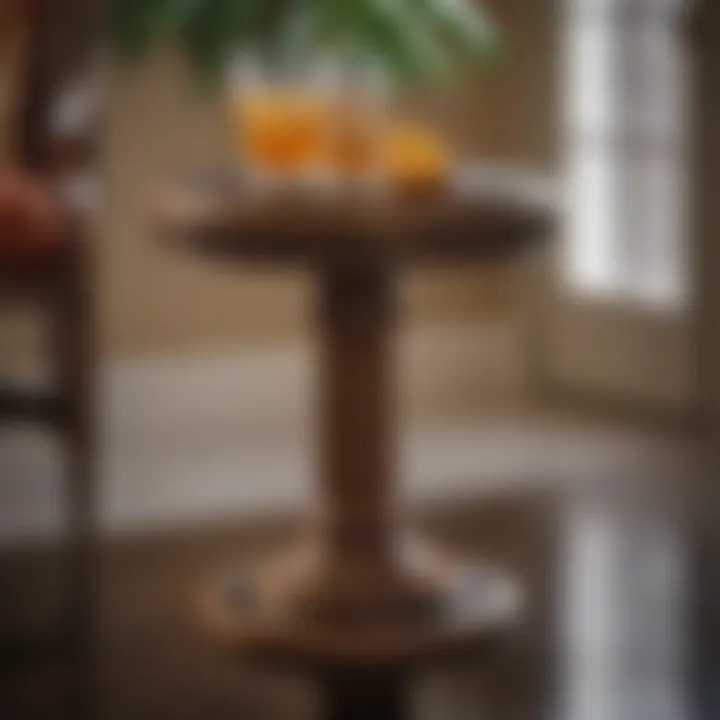 Close-up of small pedestal drink table with decorative accents