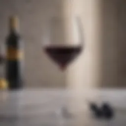 Elegant wine glass with long stem on marble tabletop